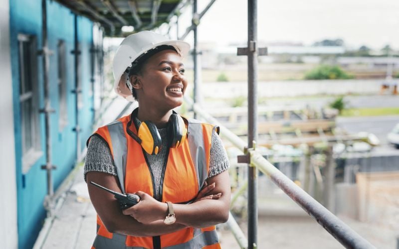 Construction industry worker standing at a building site