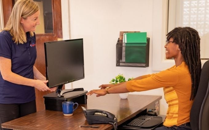 Ergonomist conducting an office ergo assessment-1