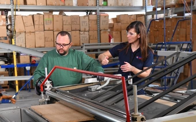 Onsite provider shows employee how to use equipment ergonomically