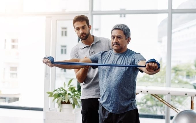 Physical therapist working with an employee (1)