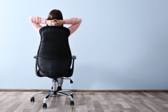 Woman sitting in adjustable office chair