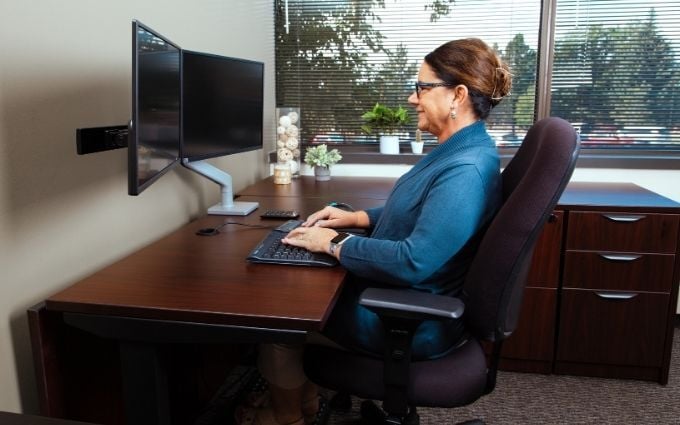 Woman working at office desk with neutral posture