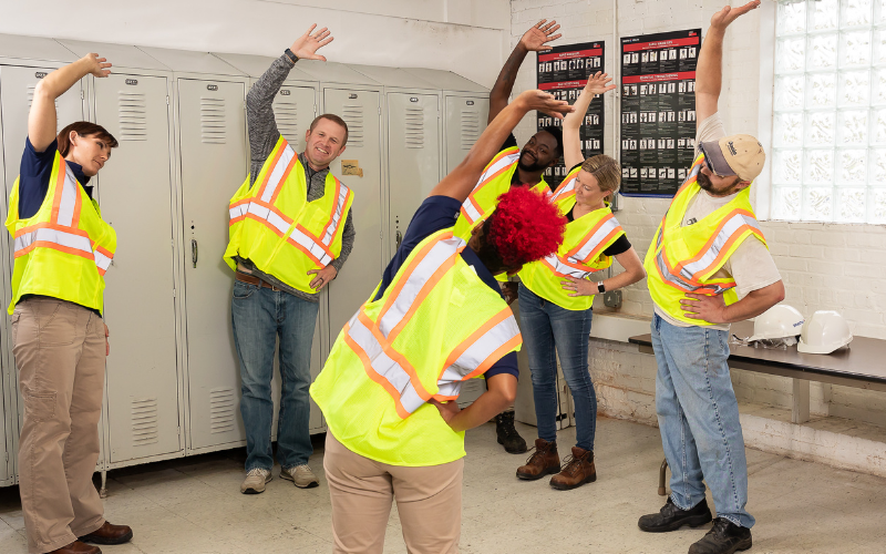 Workers stretching before shift