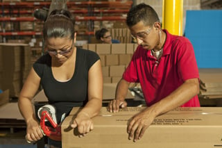 bigstock-Hispanic-workers-taping-box-in-185532358.jpg