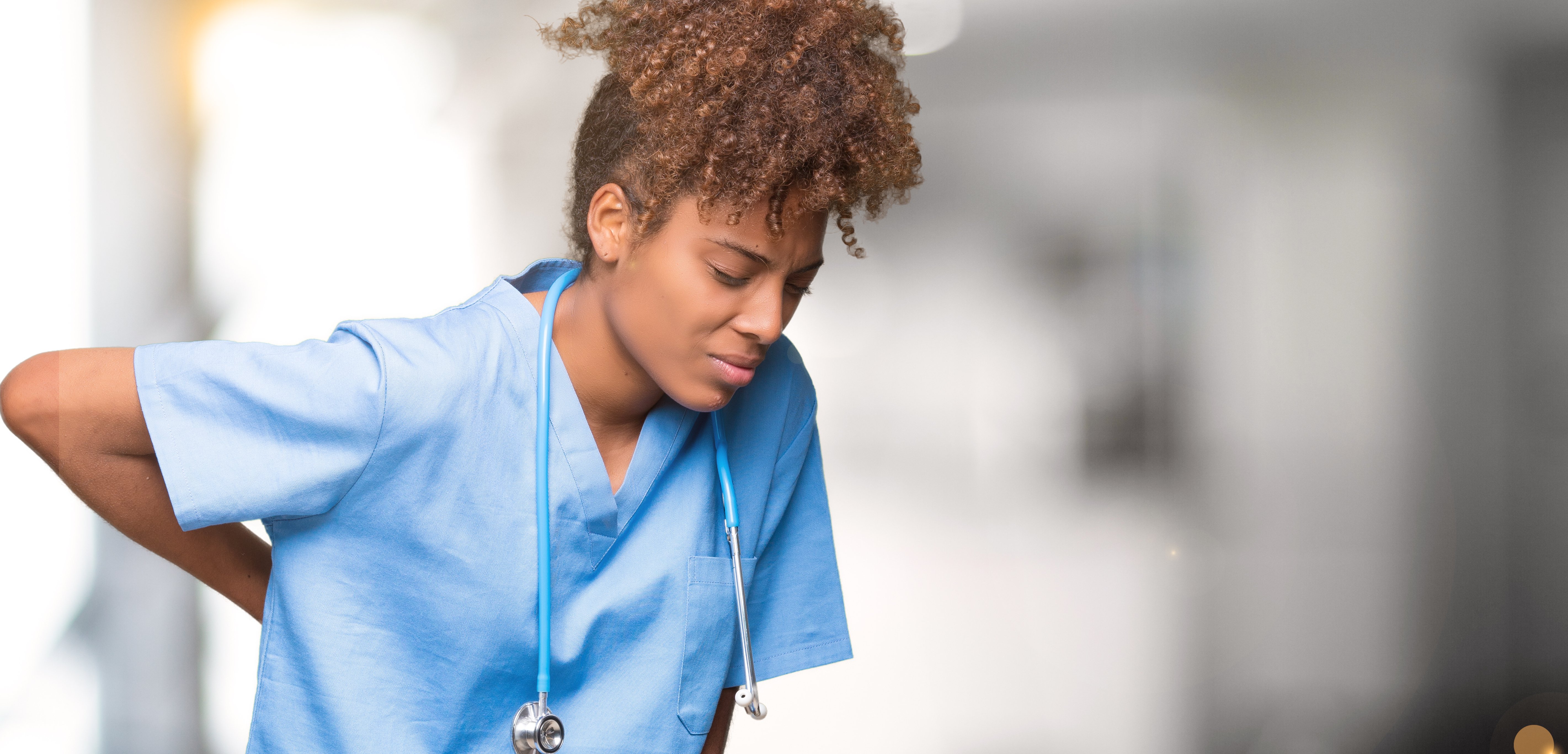 a lady nurse having lower back pain