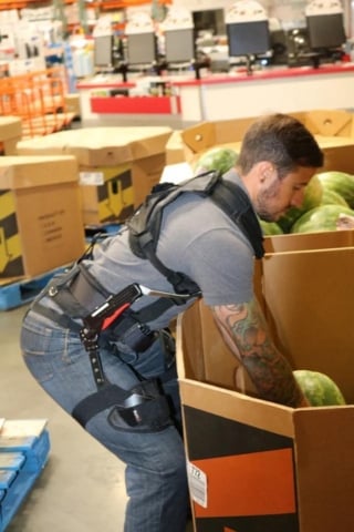 warehouse employee working exoskeleton