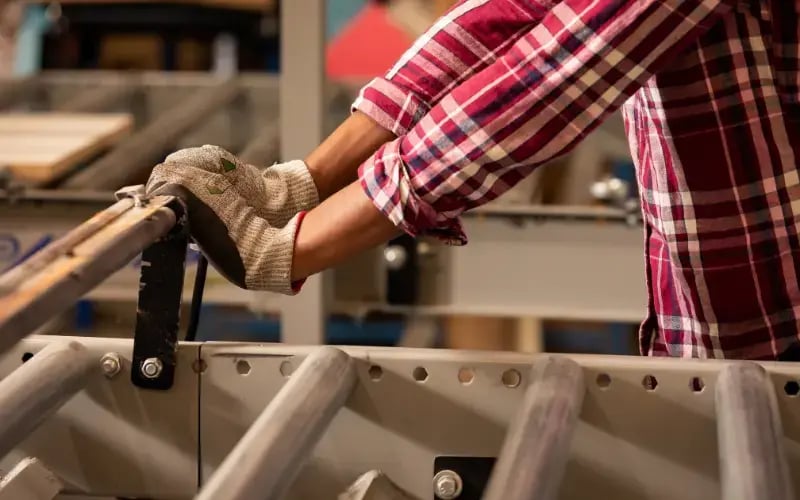 worker pushing equipment